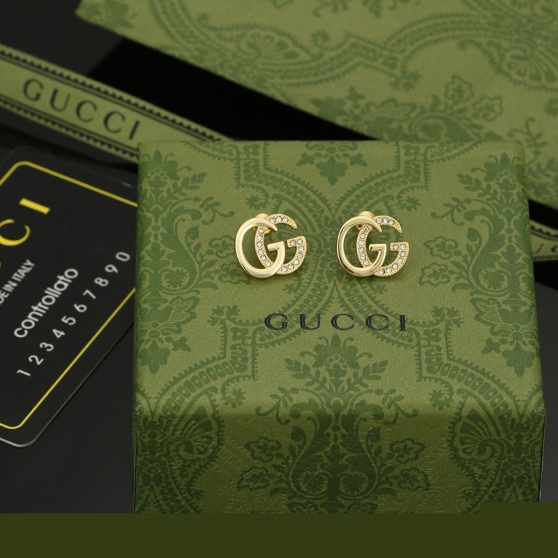 G*u*i earrings